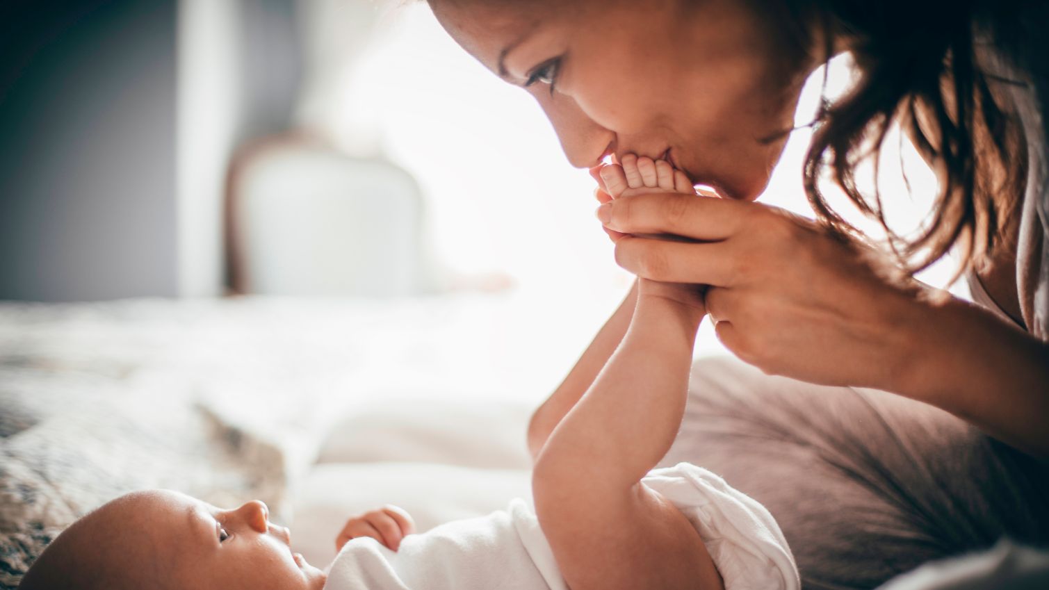 Mom plays with her baby